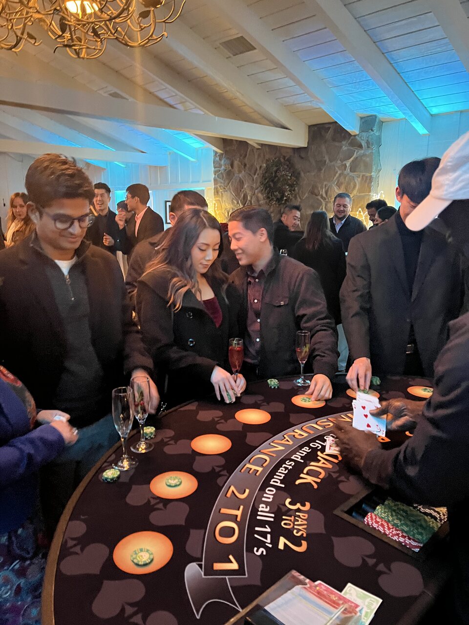 Guests playing blackjack with a pro dealer at a Honolulu casino night