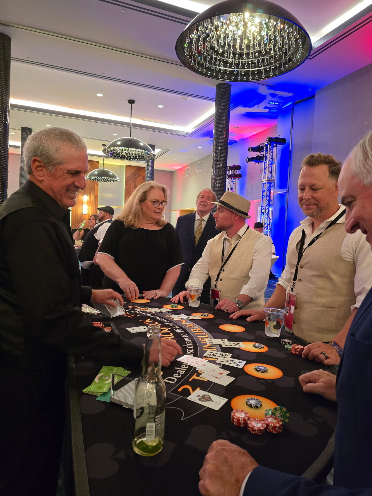 Guests playing blackjack at a Honolulu hotel ballroom casino party