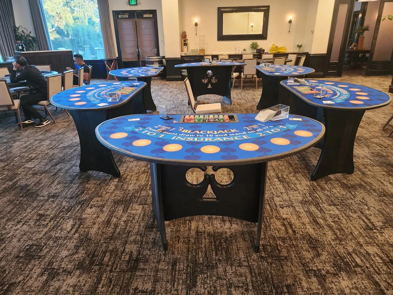 Rows of blackjack tables at a Honolulu fundraiser casino night