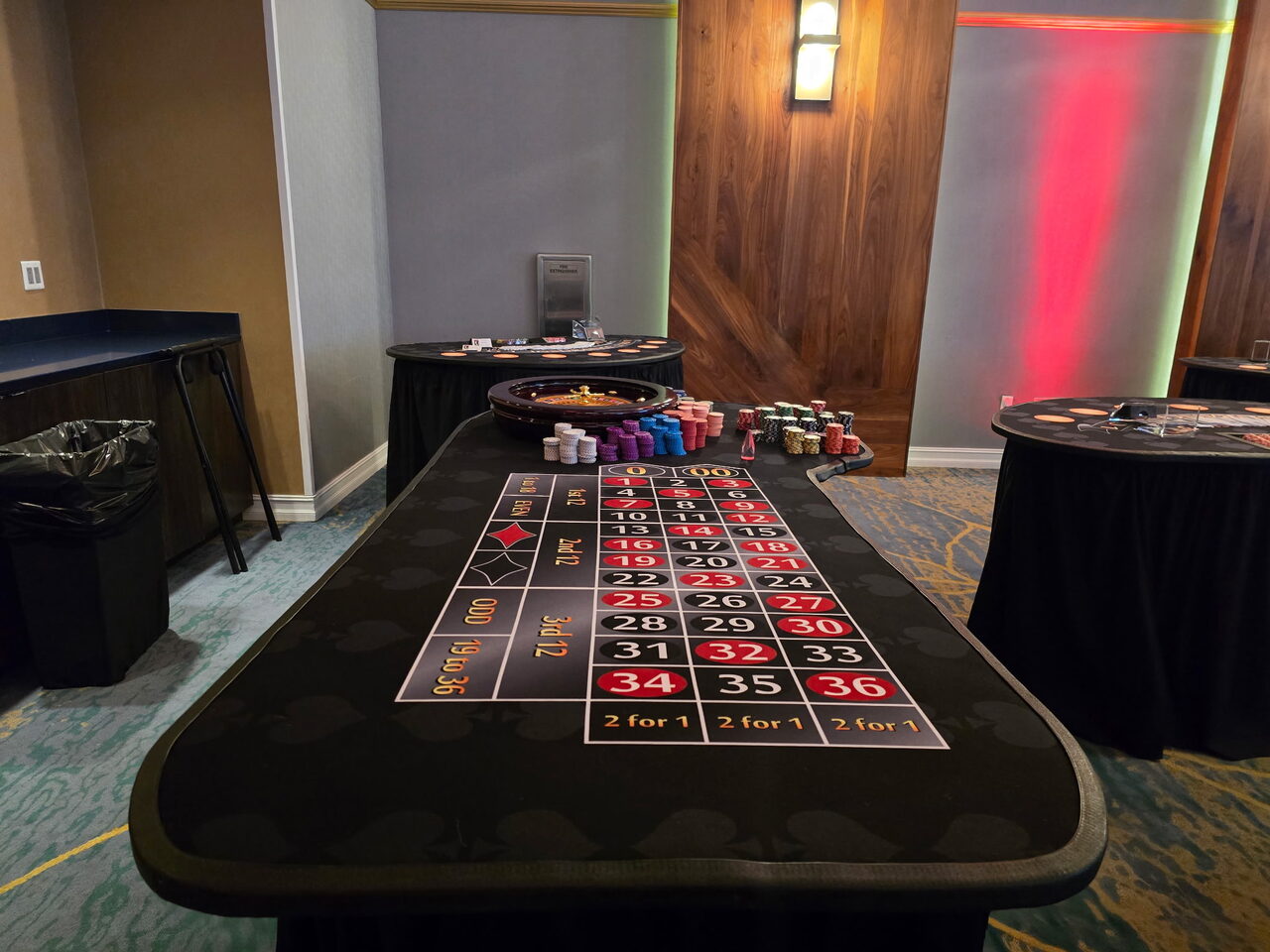 Roulette table set up in a hotel ballroom for a Waikiki casino party
